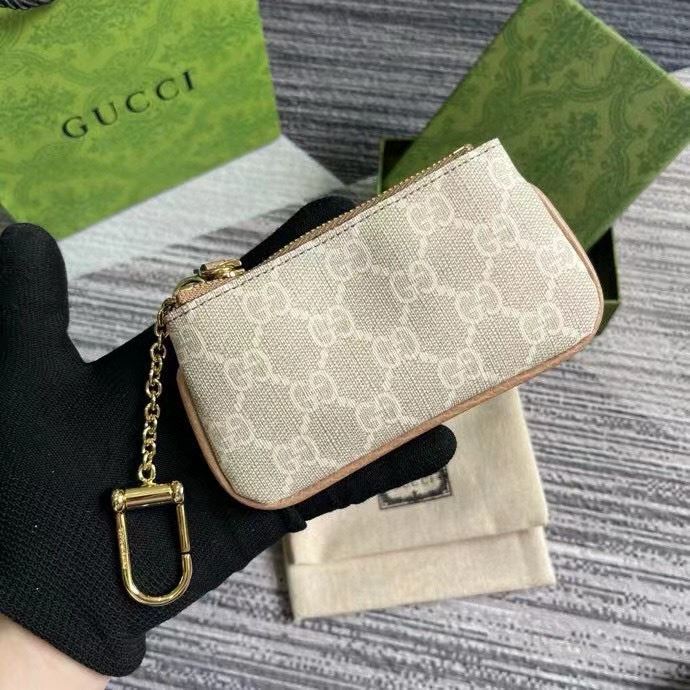 G*u*i clutch bags